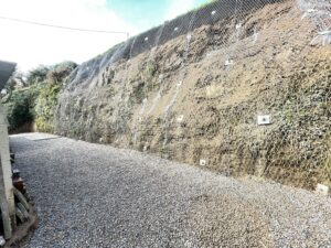 Rock face after bolting and meshing